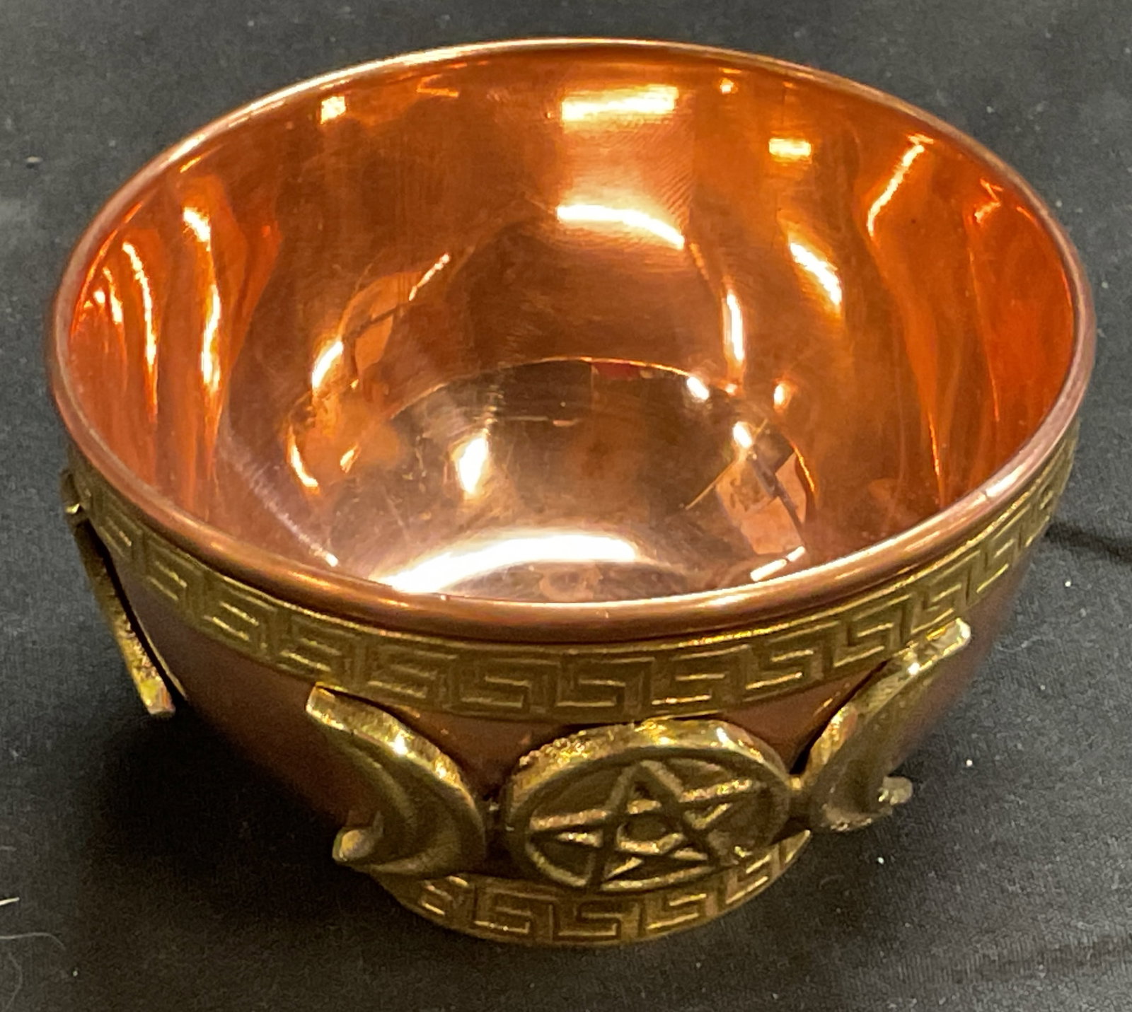 New Age Triple Moon Pentacle Copper Offering Bowl: New Age Imports Metal Offering Bowl. Copper with brass triple moon pentacle design and patterned rim. Measures app 2in H x 3in Diam. New Age Imports, moons, pentacle, Wiccan, Pagan, spiritual,