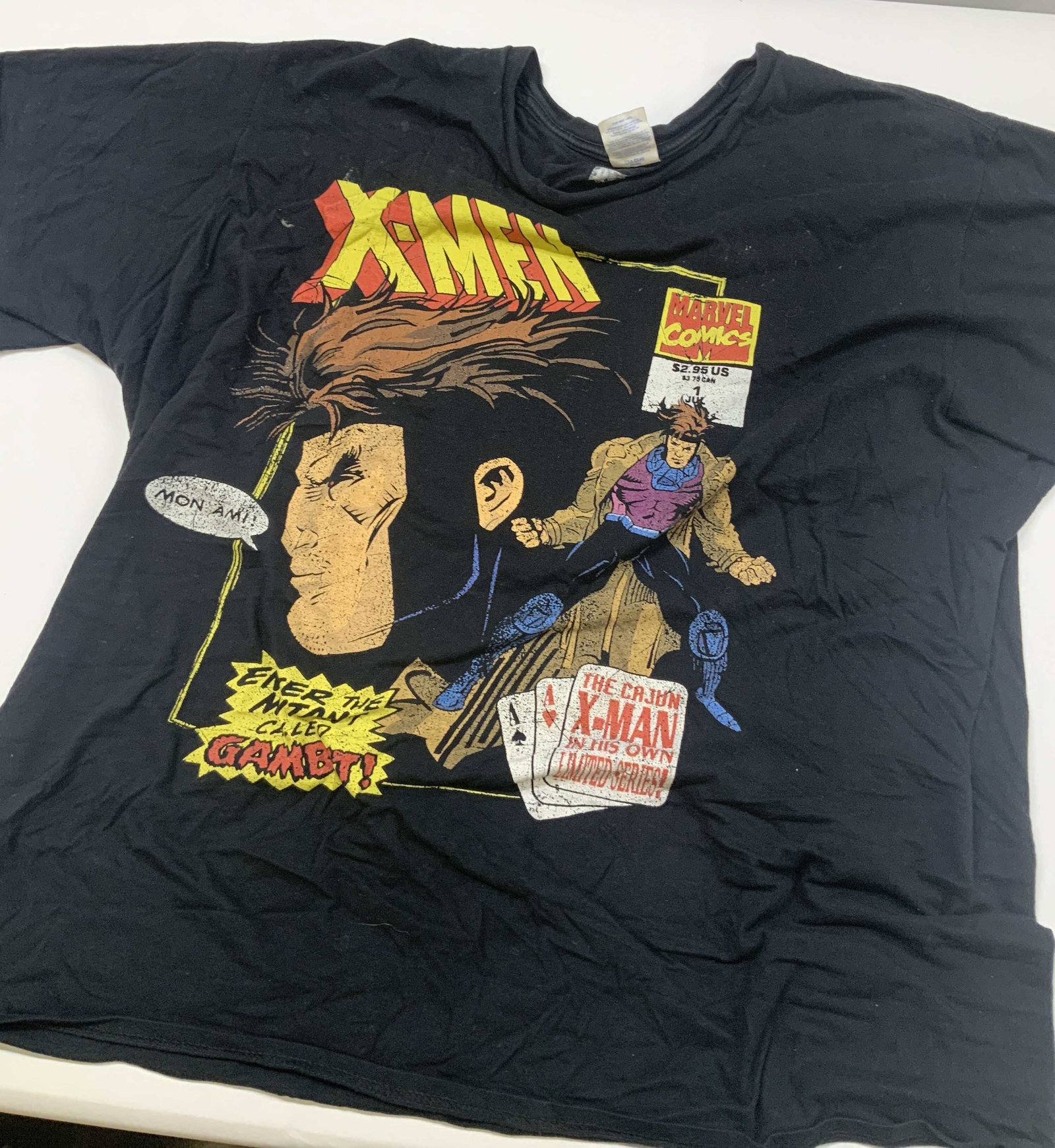 Marvel X Men t shirt featuring Gambit: Marvel X Men t shirt featuring Gambit. The graphic tee is a highly popular retro style design dedicated to Gambit. the shirt art pays homage to the early 1990s comic book cover formatting. It