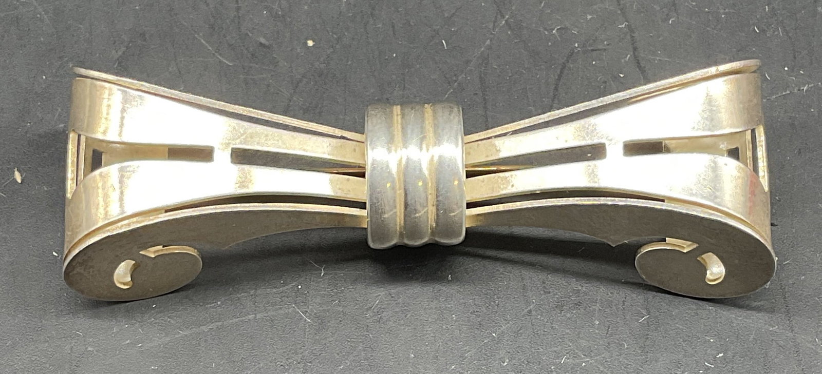 Vintage Monet Sterling Silver Bow Tie Brooch: Vintage Monet sterling silver bow tie brooch. Measures approx. 2.75 x 1 inches. Marked sterling. Total weight 19.5 grams. Some scratching. Jewelry, estate jewelry, fine, jewelry, cocktail jewelry,