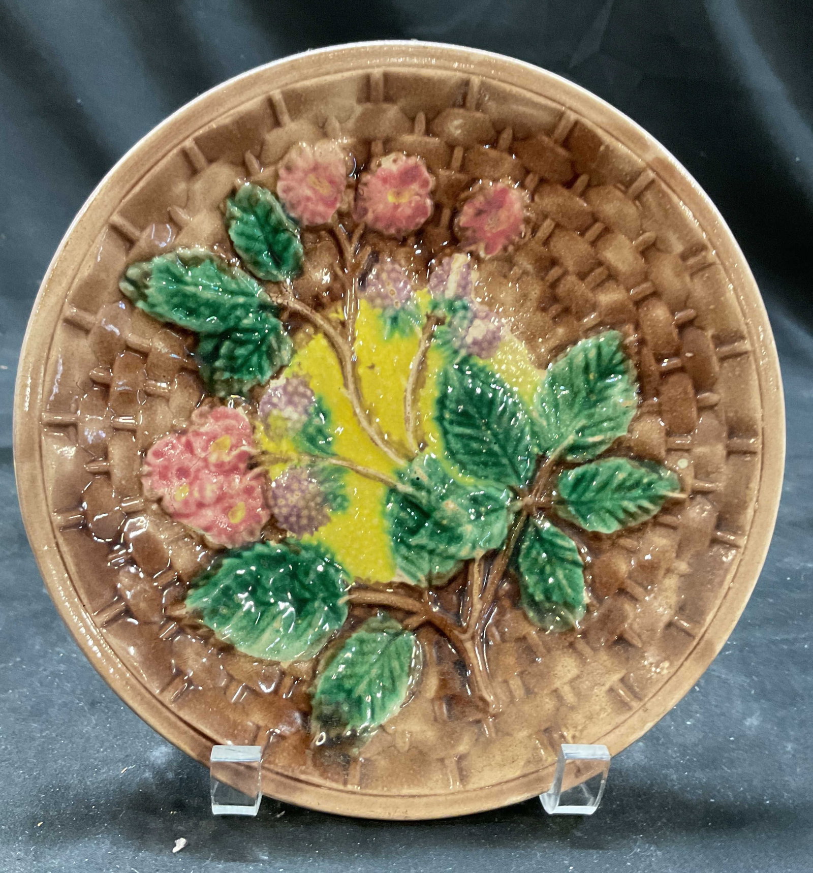 Antq Majolica BlackBerry Basketweave Plate: Antique majolica plate blackberry and basketweave pattern manufactured 1880-1890, the design features a highly detailed relief molded motif of wild blackberry branches vibrant green leaves, pink