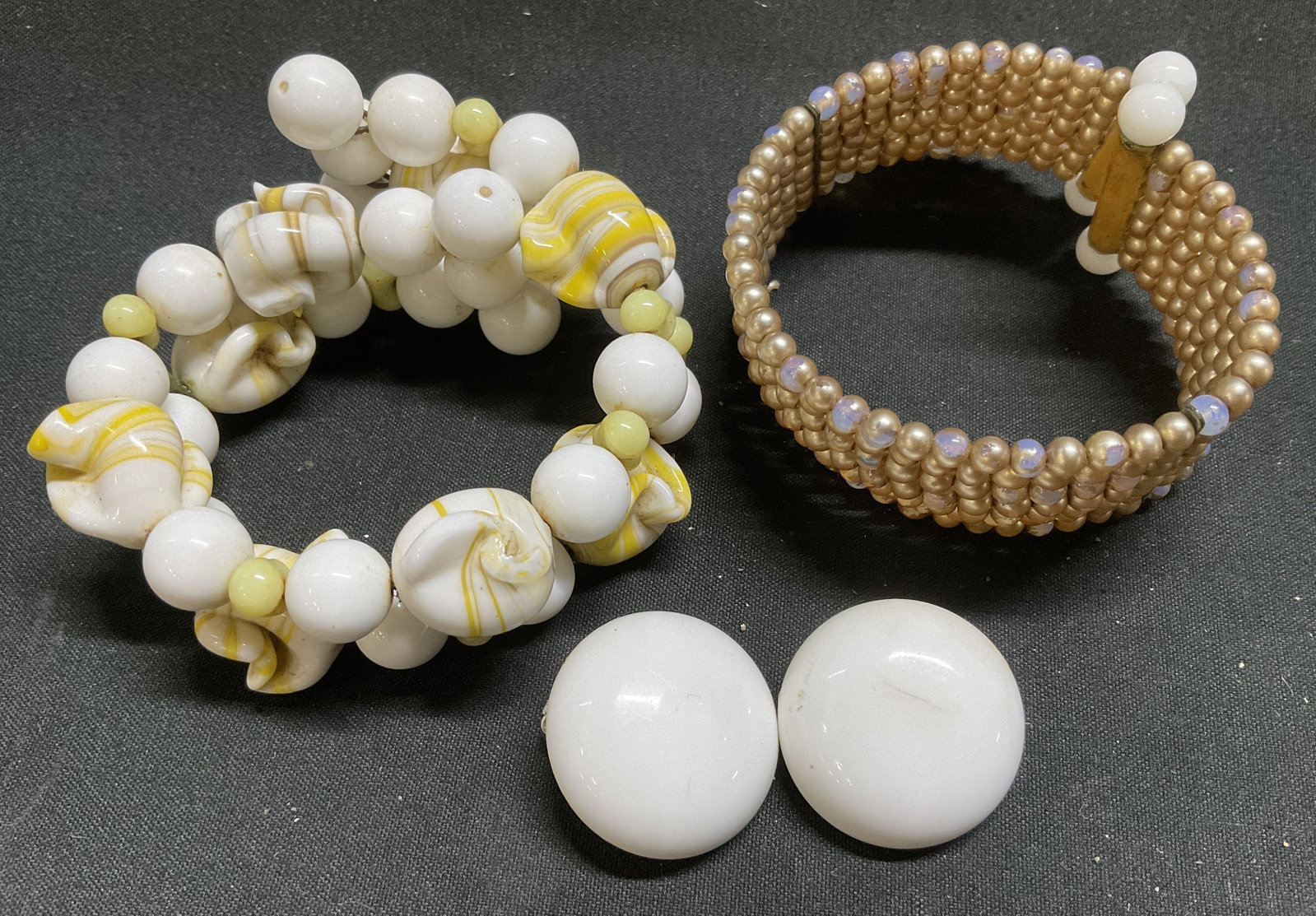 Lt3 Vintage Costume Jewelry Beaded Bracelets+: 3 Vintage Costume Jewelry Pieces. Includes a Chunky Cluster Bracelet with Opaque Milk White and Swirled Yellow Glass Beads, a Woven Multi-Row Cuff Bracelet with Beige and Purple Seed Beads, and White 