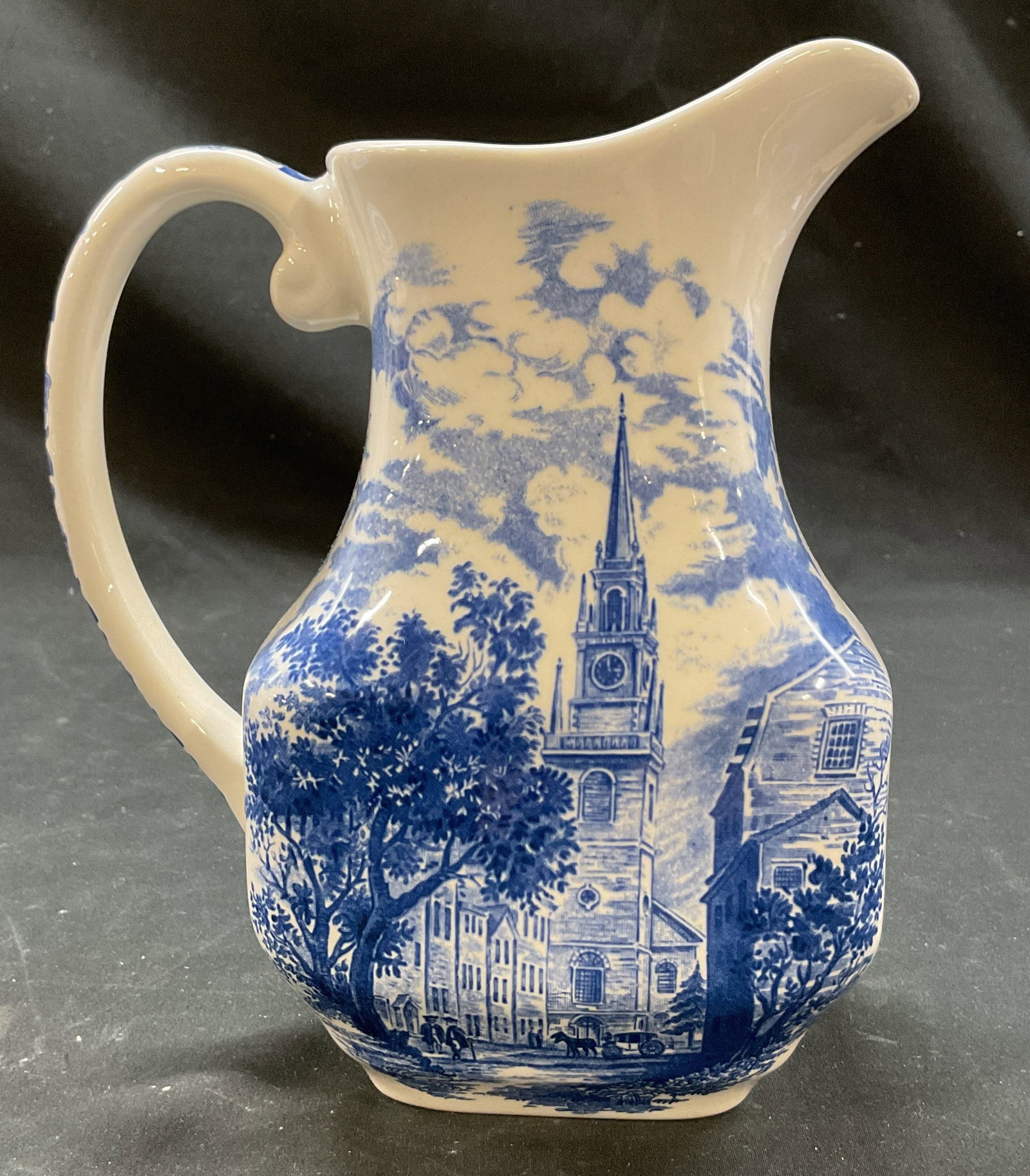 Staffordshire Liberty Blue Church Pitcher England: Liberty Blue Staffordshire Old North Church porcelain pitcher. Marked on underside, made in England. Blue and white scene of Old North Church. Floral motifs, curved handle and spout. Measures ht appro