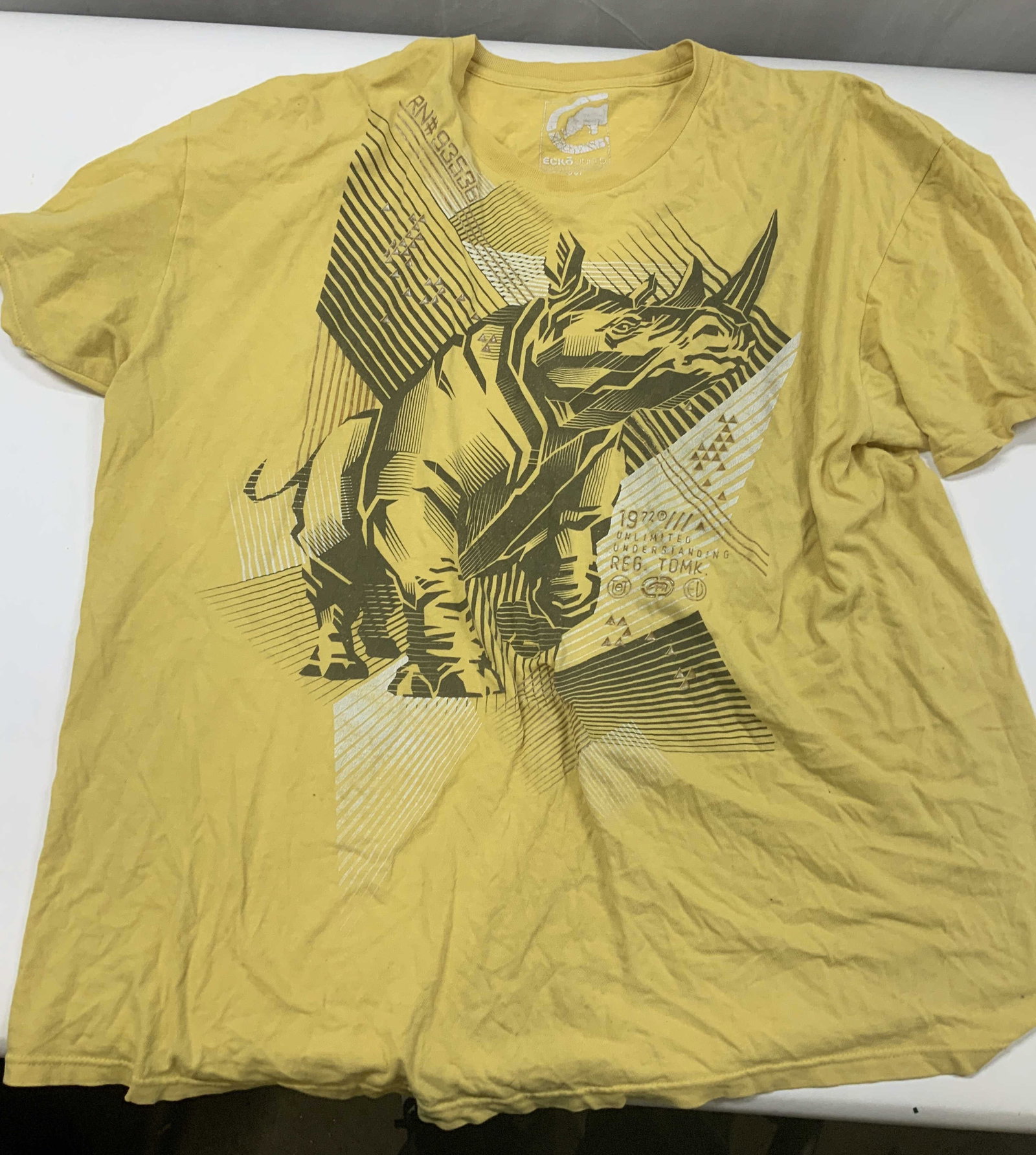 Vntg ECKO UNITED UNLIMITED graphic t shirt, 2000s: Vintage ECKO UNITED UNLIMITED graphic t shirt. Made in the 2000s from 100% polyester in Mexico, size XXL. The front features an oversized heavily detailed black illustration if the brands ic Indic rhi