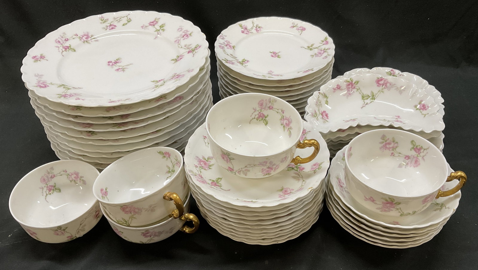 St 56 VTG Haviland Limoges Rose Dish Set FRANCE: 56 Vintage Haviland Limoges Pink Rose Porcelain Dish Set. France. Decorative Scalloped Edges. Includes 5 Teacups, 11 Saucers, 6 Bowls, 12 Dessert Plates, 12 Dinner Plates, and 10 Crescent-Shaped