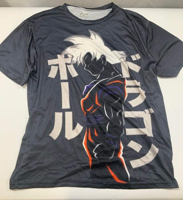 Dragon Ball Super Ultra Instinct Goku graphic tee: Dragon Ball Super Ultra Instinct Goku graphic t shirt. The front and features the same graphic. It is a side profile silhouette of Son Goku. The silhouette contains red and blue highlights to emphasiz