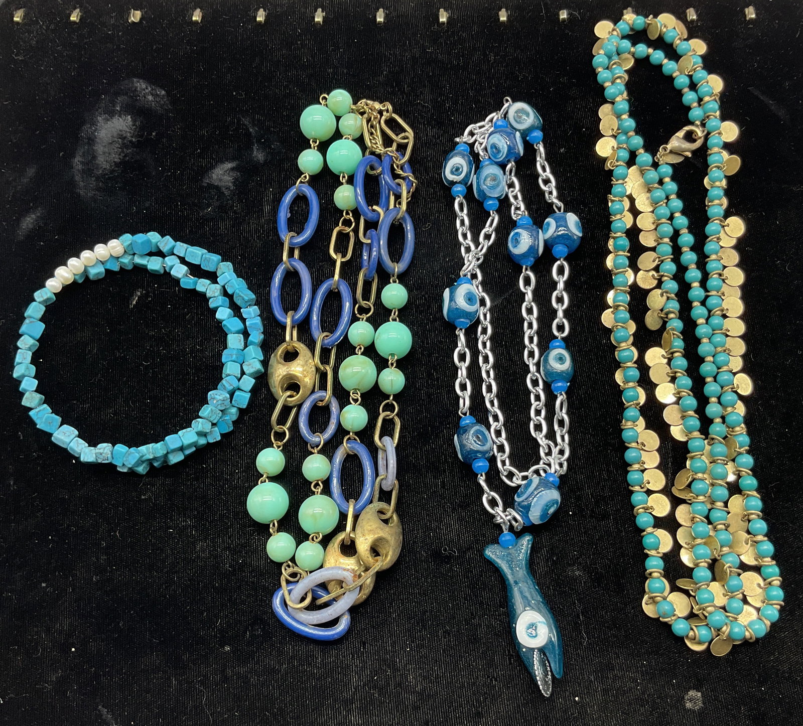 Lot 4 Vintage Assorted Blue Necklaces Chicos+: Lot of 4 vintage assorted blue necklaces. Turquoise toned resin beads with pearl accents. Turquoise toned glass beads with gold toned disc shaped accents, marked Chicos. Blue oval shaped lucite beads 