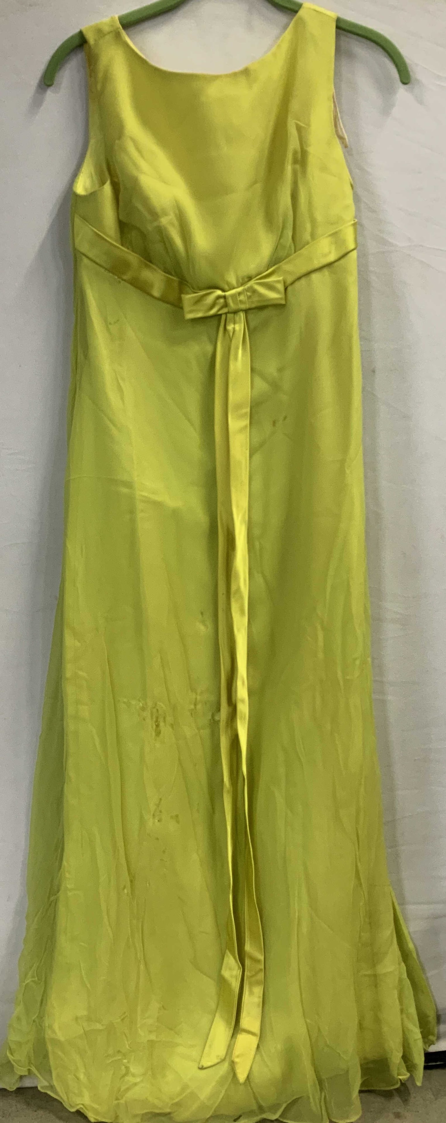Vntg Lady Taylor yellow formal maxi dress: Vntg Lady Taylor yellow formal maxi dress. Yellow dress in satin like fabric with bow detail at the waistline. Constructed with a chiffon overlay that covers the entirety of the dress. Tailored top an