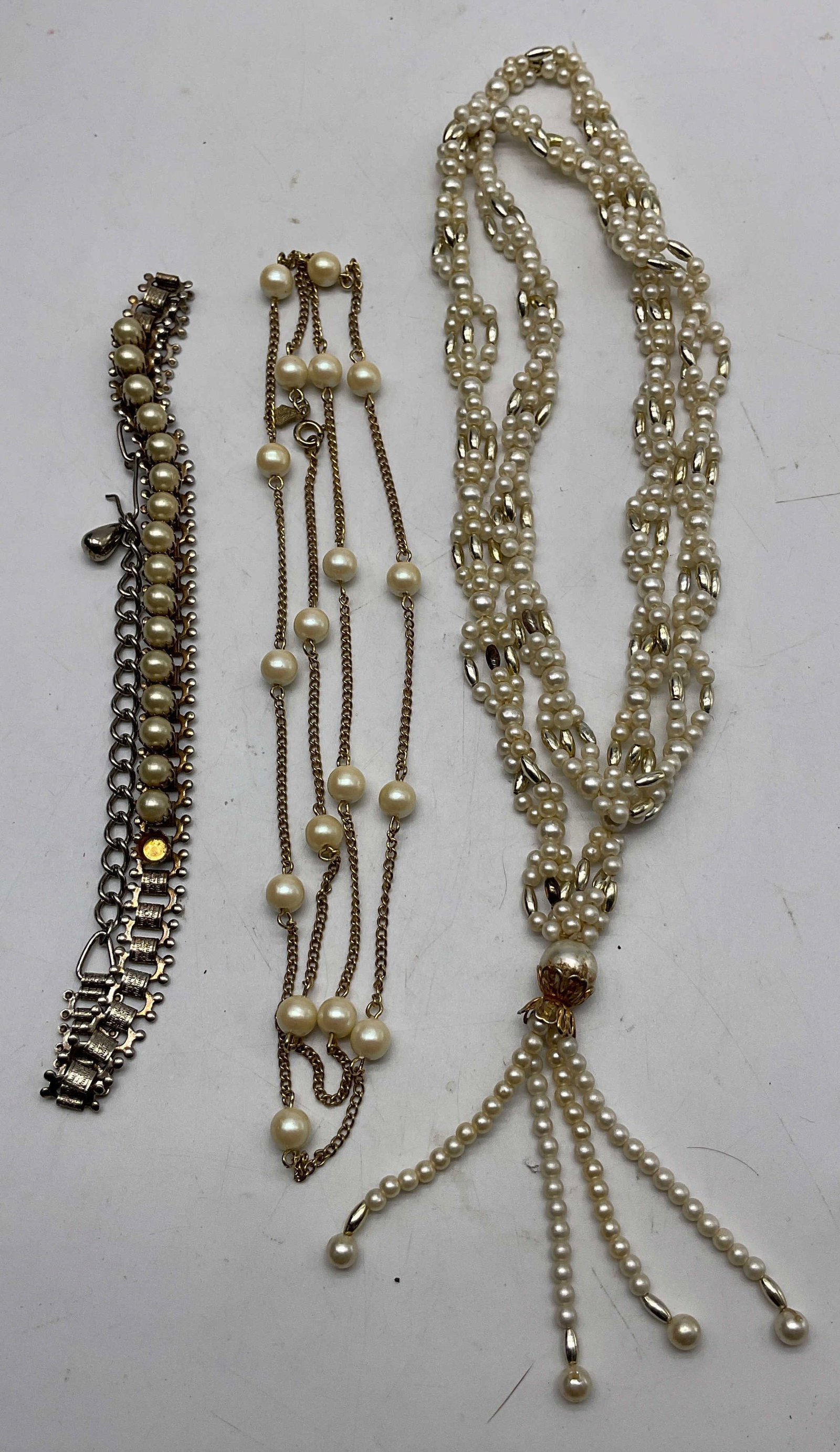 Lot 3 Vtg Assort Pearl Style Necklaces Sarah Cov+: Lot of 3 vintage assorted faux pearl necklaces. One marked Sarah Cov. Pearl style designs, fringed designs. Silver and gold toned. Unique closures. Largest measures approx 20 inches drop length.