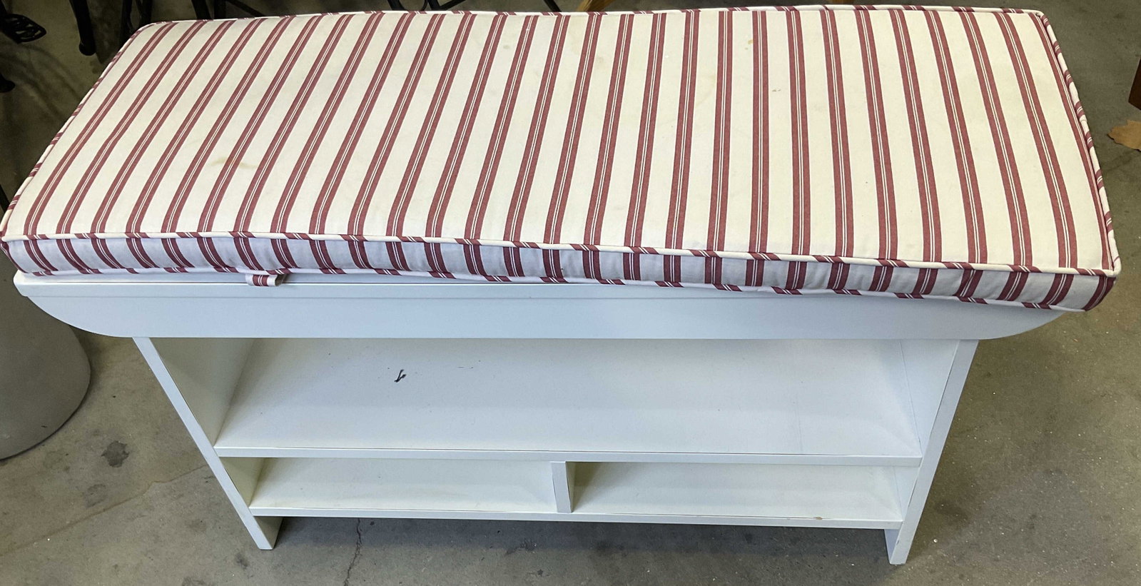 White Wood Bench, shelves and Cushion: White wood bench with two shelf levels and removable red white striped cushion, cushion and wood have some wear, with cushion measures ht 21.5 inches depth 14 inches, length 36 inches