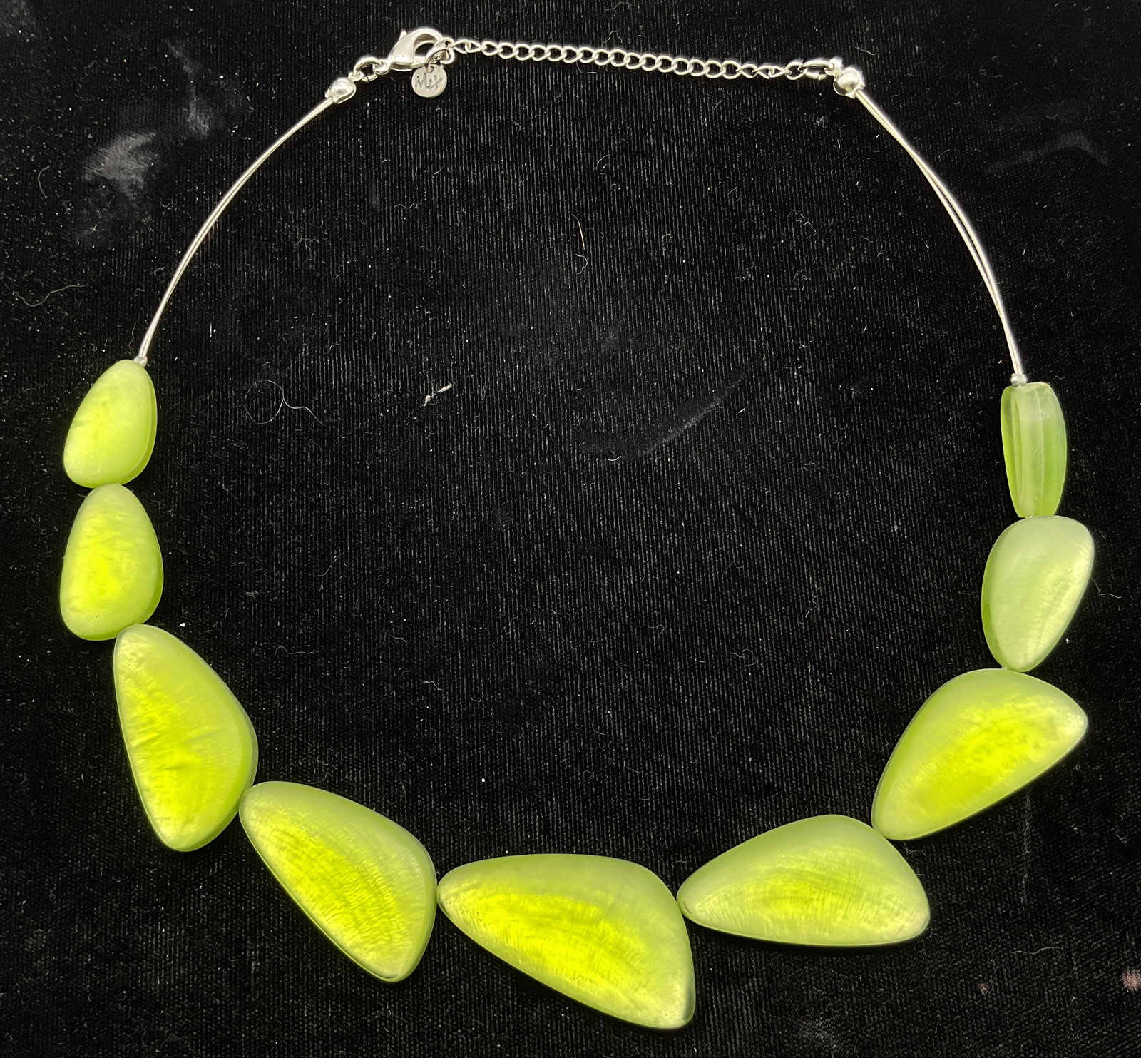 Culture Mix Silver Toned Green Beaded Necklace: Culture Mix silver toned green beaded statement necklace. Marked Culture Mix. Distinct green geometric resin beads on silver toned chain. Shape and size vary. Measures approx 7 inches drop length. Scr
