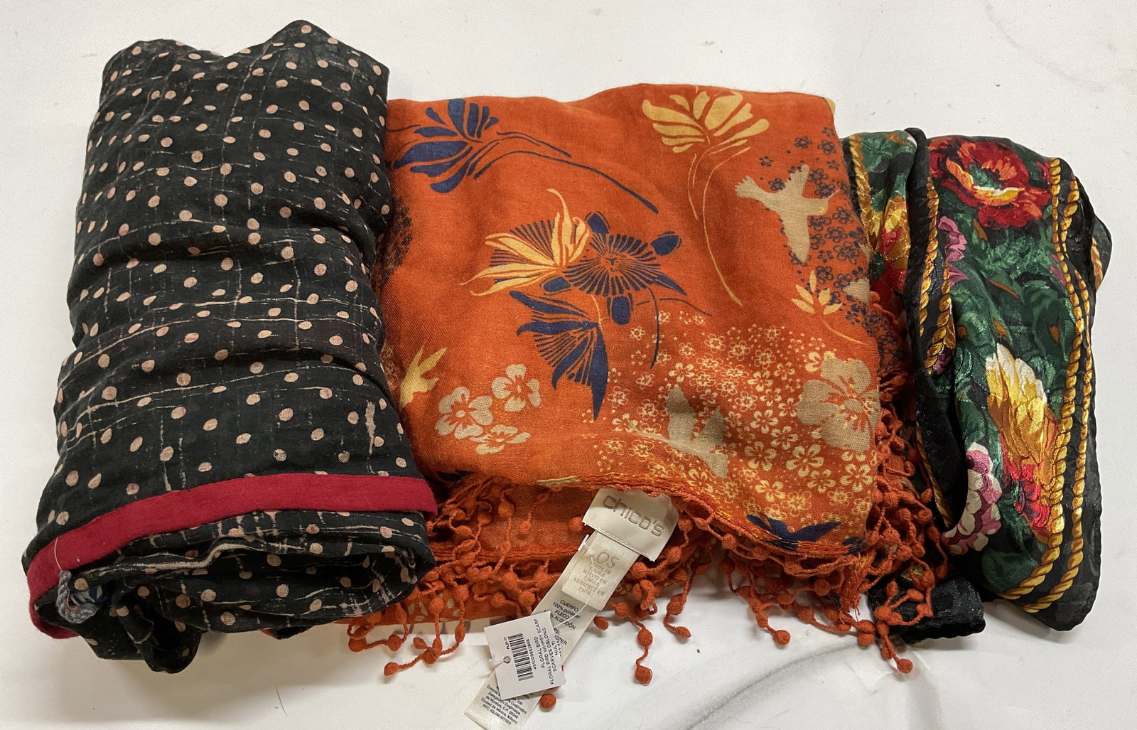 Lt3 OT Chicos, Namaste NYC, Korean+ Scarves: 3 Patterned Fashion Scarves. Original Tag Chicos Floral Bird Whimsy Scarf with hummingbirds on orange background one size. Namaste NYC polka dot pattern scarf with red border. Silk-Style floral scarf 