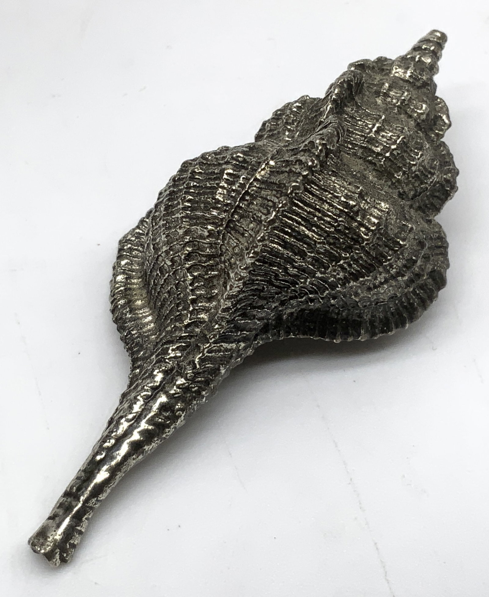 Vintage Decorative Silver-Toned Conch Shell: Vintage Decorative Silver-Toned Conch Shell. Textured, ribbed spiral body. Condition consistent with age and exposure. Measures app 2.5in H x 1in W. vintage decorative objects, silver-toned, conch