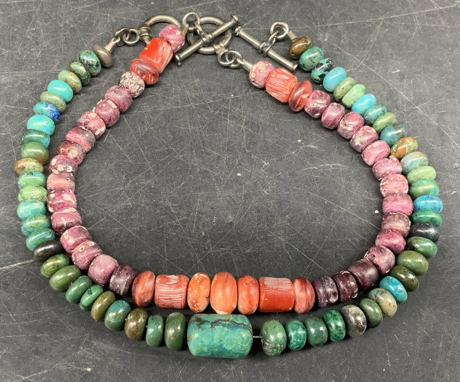 Lt2 Beaded Semi-Precious Gem Bracelets Sterling: 2 Beaded Semi-Precious Gemstone Bracelets/Anklets. Clasps test as Sterling Silver with PuriTEST. Pink bracelet appears to be made up of pink tourmaline and red coral. Blue bracelet appears to be made 