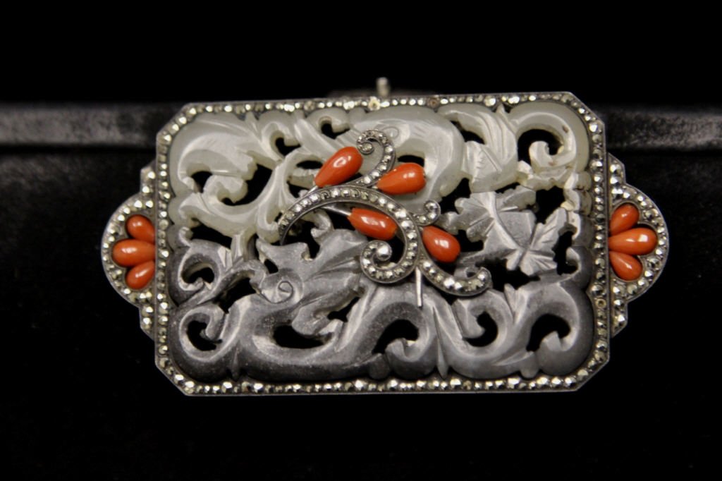 Vintage Purse w. Sterling Jade & Coral Clasp: Antique suede purse w. ornate clasp having carved jade dragon pendant mounted in 935 silver set w. coral & marcasite. Silver hallmarked 935 F-A. Third hallmark illegible. Measuring 6 inches by 9 inche
