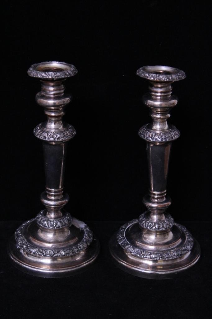 Pair French Rococo Style Silver Plate Candlesticks: With rocaille shell details. Height 10 inches. Diameter of base 5 inches. Property of a Larchmont, NY estate.