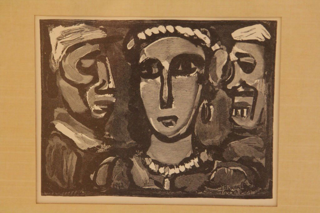 Georges Rouault Les Visages Wood Engraving: Professionally framed & matted. Information on verso about print. Measures 15.5 inches by 17 inches.