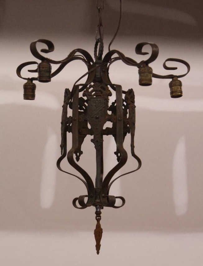 Antique Tudor Style 5 Armed Chandelier: Height 23 inches plus chain .Diameter 18 inches.