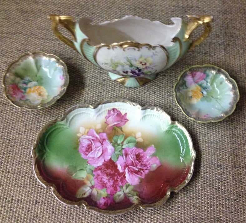 Assorted Nippon & German Made Porcelains: Centerpiece signed Mary F. Wood 97’. Large plate measures 12 inches by 9 inches.