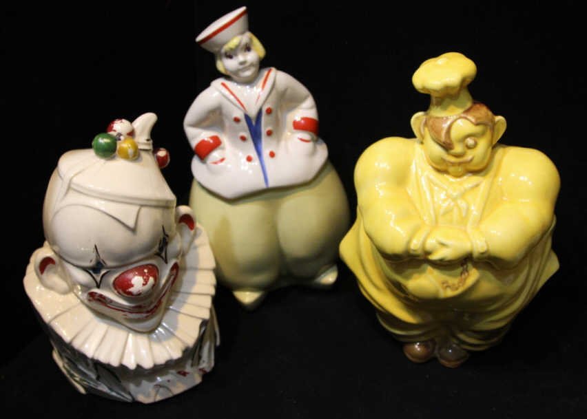 Assorted Vintage & Mid Century Cookie Jars: Clown marked McCoy. Clown with wear to painted details. Dutch Sailor Girl apparently unmarked. Chef marked on bottom. Height of tallest 12 inches.