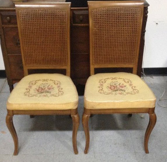 Pair Needlepoint Cushion Caned Back Side Chairs: Handmade needlepoint seats. Height 40 inches. Width 19 inches. Depth 17 inches
