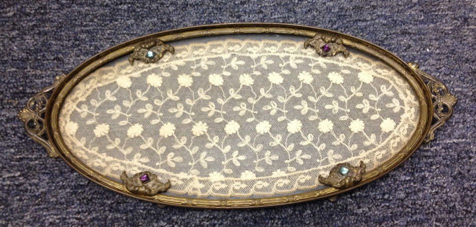 Antique Continental Jeweled Vanity Tray: Lace behind glass, gilt metal and jeweled frame. Measures 14 by 6 inches.