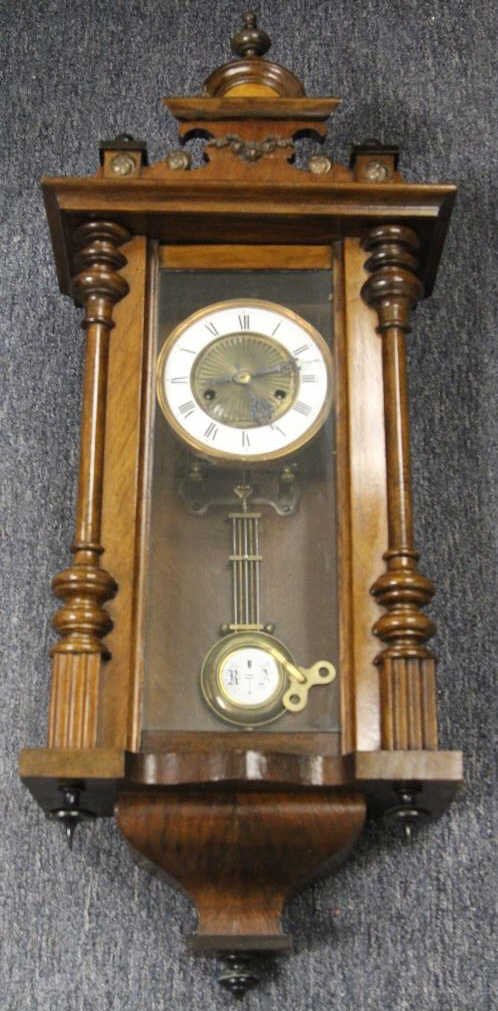 Antique Continental Vienna Regulator Wall Clock: Late 19th century case. Enamel on metal face with gilt trim. Height 31 inches. Width 13 inches. Depth 7 inches.