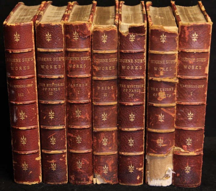 Antique Leather Bound Books Eugene Sue’s Works: Wandering Jew, The Mysteries of Paris, Arthur, Pride, & The Knight of Malta. Books measures 9 inches by 6 inches.