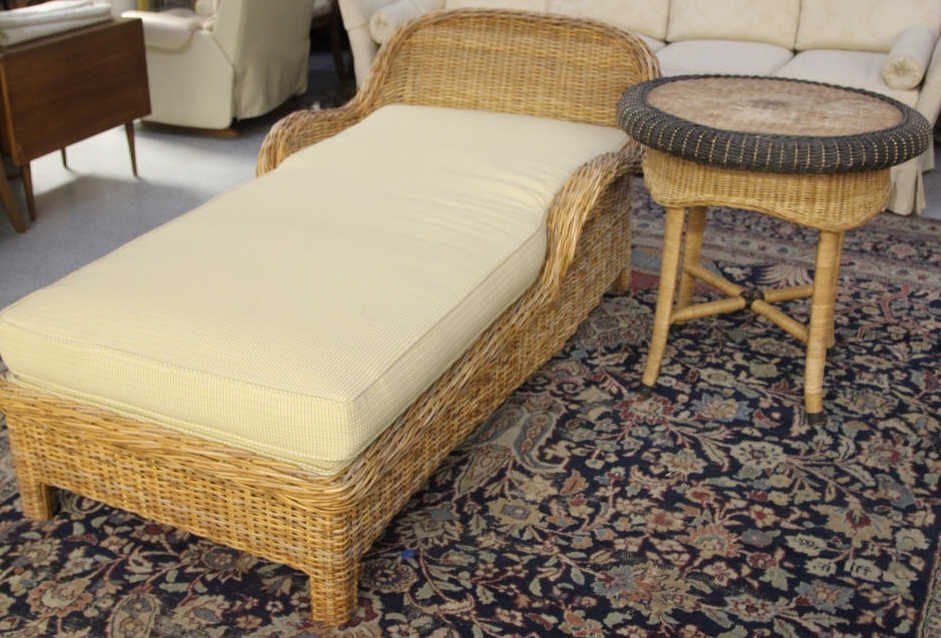 Walter's Wicker Chaise Lounge & Table: Chaise lounge measures; Height 30 inches. Width 37 inches. Length 66 inches. Purchased by consignor at Walter's Wicker in the D & D Building.