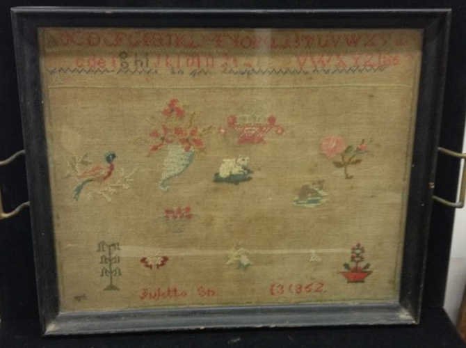 Antique 19th Century Needlework Sampler: Showing alphabet, animals, flowers, etc. Framed & mounted as tray. Measures 22 inches by 16 inches.
