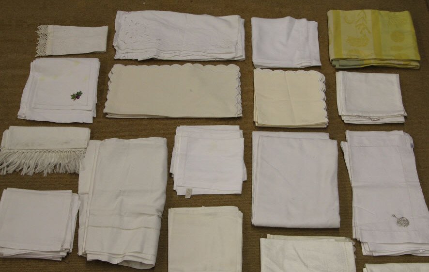 Large Assortment Vintage & Contemporary Linens: Various table and household linens. Including French table clothes, napkins, place mats, runners, hand towels, etc. Various sizes, makers & conditions.