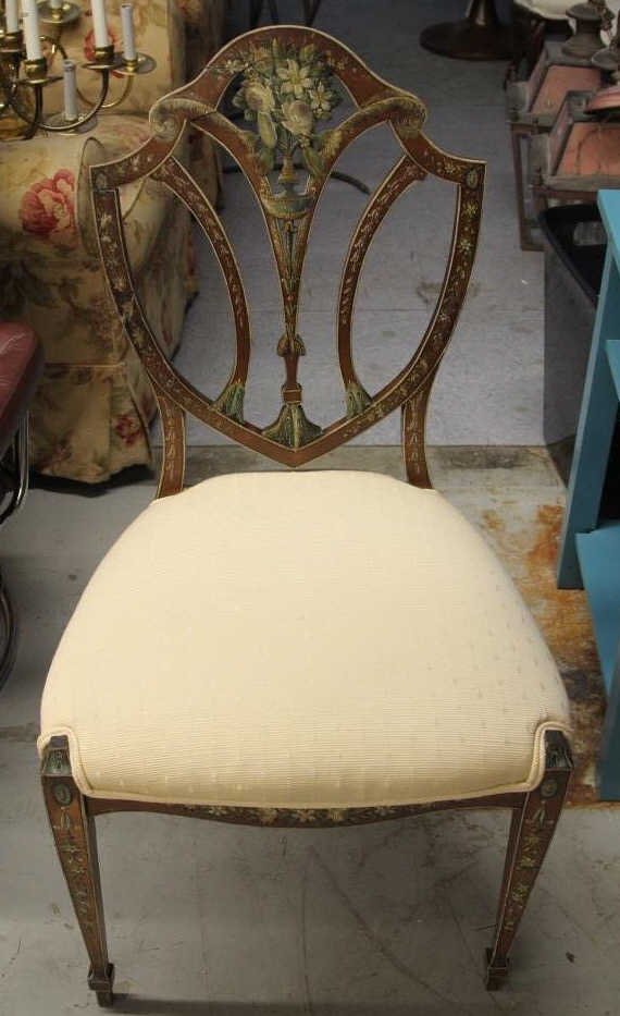 Fine Hand Painted Sheraton Style Shield Back Chair: Hand painted back and legs in Neo Classical and Renaissance style details. Height 38.5 inches. Width 20 inches. Diameter 19 inches.