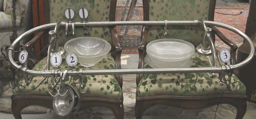 Antique Hanging Pot Rack With Light Fixtures: Purchased at Howard Kaplan Antiques, NYC. Oversized oval with cross hatched chrome finish. Width 61 inches. Depth 22.5 inches.