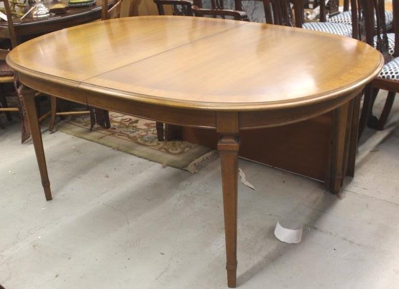 Oval Dining Room Table: Three Leaves, mahogany banded w. apron. Height 29 inches. Width 44 inches. Depth 67 inches. Each leaf measures 7 inches.