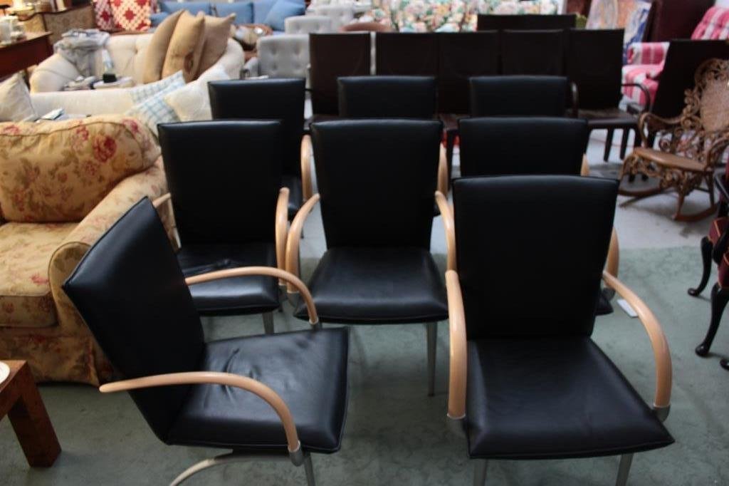 8 Black Leather: With wooden arm chairs. Rolf Benz aluminum frame, wood arms, leather seats. Original cost$ 17,400.00. Height 39 inches. Width 21 inches. Depth 20 inches.