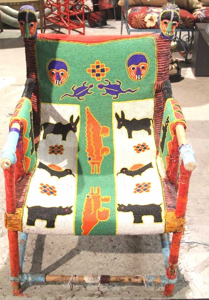 Antique handmade Colorful African Chair: Purchased from Linda Horn Antiques NYC Colorful weave on seat, arms, and back with intricate bead work. Height 35 inches. Width 25 inches. Depth 24.5 inches.