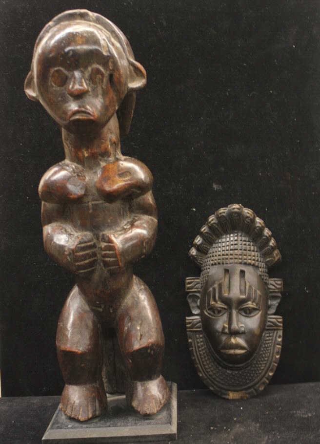 Carved Polynesian Statue on Base & Tribal Mask: Some chips. Apparently unsigned. Height of tallest 19 inches.