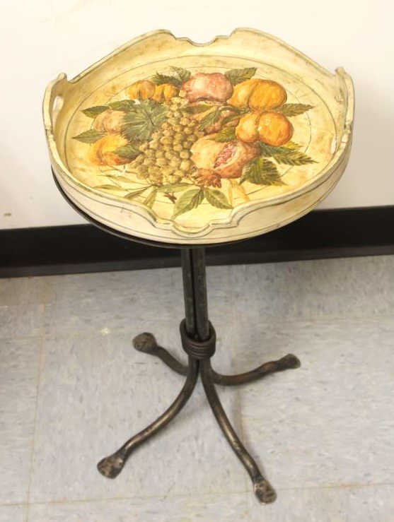 Hand Painted Fruit Motif Tray Table on Iron Base: Hand forged Iron Base Stand. Tray detachable. Some chips in tray. Height 22.5 inches. 13.5 Diameter