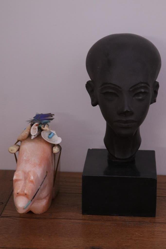 Egyptian Clay Head & Southwestern Marble Bear: Both pieces apparently unsigned. Head mounted on stone base. Several small chips. Height of head 11 inches. Ceremonial pink marble bear with brass and stone inlay. Several small chips