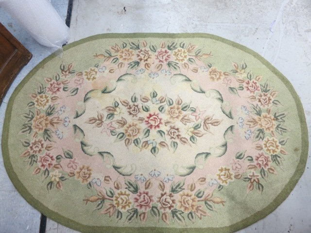 Antique Needlepoint oval rug: Approximately 70 inches by 45 inches. With backing.