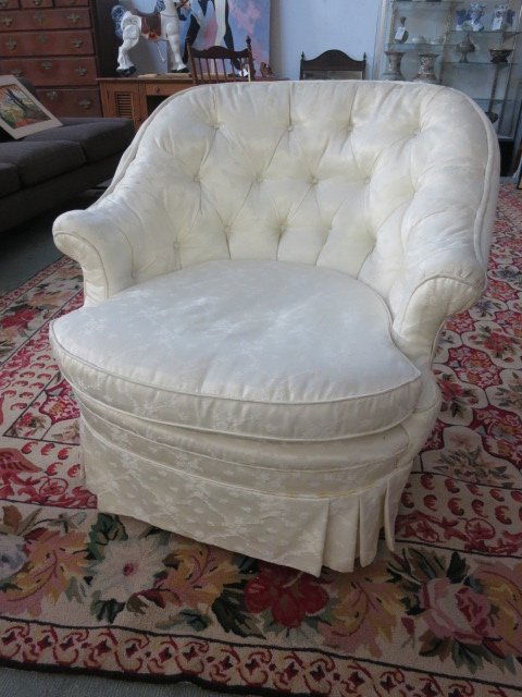 William Sonoma Barrel chair: Pewter linen tufted back chair on casters. Some sliglht pulls to fabric. Measures 33 inches wide 33 inches deep 31 inches high.