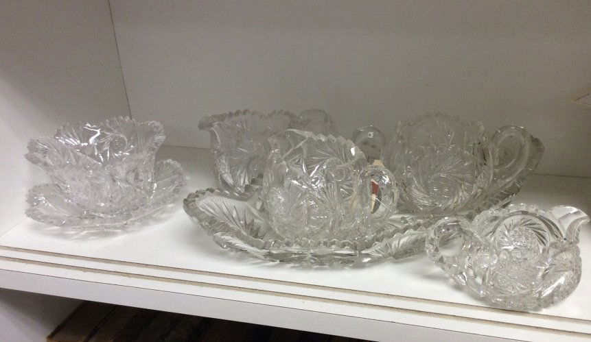 Assorted Cut Crystal Pieces: Hand cut. 1 bowl, 1 candy dish, 3 serving pitchers, 1 platter, 1 low rise pitcher. Tallest measures 2.4 inches