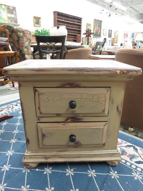two drawer cocoa colored painted end table: Measures 26 inches wide 17 inches deep and 25 inches high. Originally made by Broyhill, the piece has been sanded and refinished and hand painted into a one of a kind two drawer end table. The finish