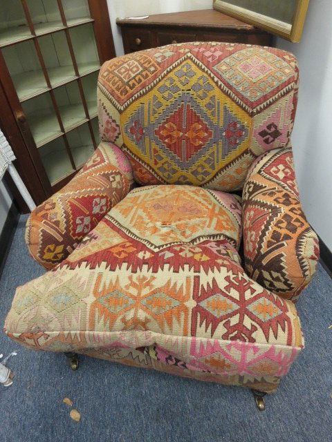 George Smith Indigeneous Chair and Ottoman: Kilim Chair has canister rollers. Very comfortable deep seat. Measures 35 in. x 40 in. D x 32 in. W. Good condition. From a Pelham Manor, NY Estate