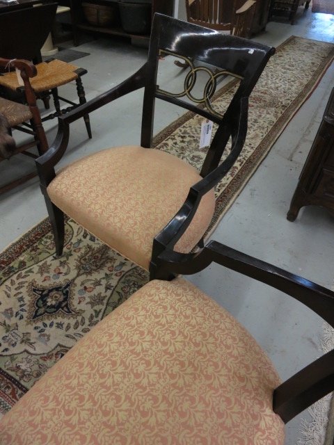 Pair BAKER side chairs: Each measures 36 inches height by 24 inches wide by 22 inches Armed Sheraton style with interwoven circular back with gold accents on dark mahogany finish. Property of multi generational Greenwich est