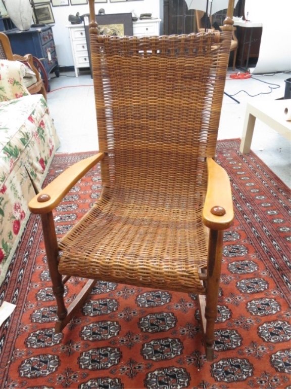 Vintage hand made wood and rattan rocker: Vintage hand made wooden and woven rattan rocker. Measures 42 inches high 22 inches wide and 16 inches deep