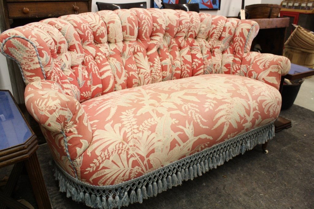 Upholstered Victorian Love Seat Sofa: Antique partial elongated horseshoe shape antique Victorian upholstered sofa love seat settee. Great lines. Measures 34 inches deep and 34 inches high. 93 inches long. Pink fabric with powder blue cho