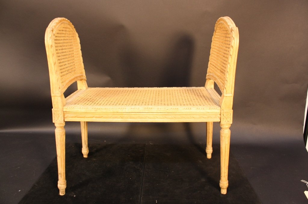 French Antique Louis XV Period Vanity Chair Bench: Carved and caned period Louis XV French Antique vanity chair or bench with two high sides and caned seat. measures. Purchased in France and brought to Greenwich Estate.