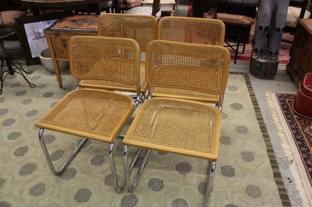 Set 4 vintage Breuer Caned and Chrome chairs: Set of 4 vintage light wood chrome and caned back chairs. Cane back and cane seats oulined in chrome frame. All in good condition. Height 31 inches. Width 18 inches. Depth 17 inches.
