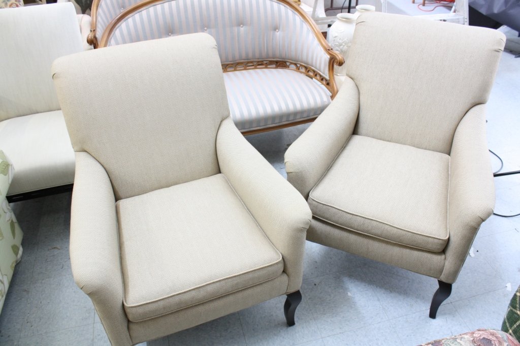 Pair of CRATE&BARREL upholstered arm chairs: Contemporary or traditional Pair upholstered armchairs. Scrolled arms, tight back, and loose cushion seat. Ebony wood legs. Transitional style. Sculptural silhouette. Crate & Barrel. Each measures. He