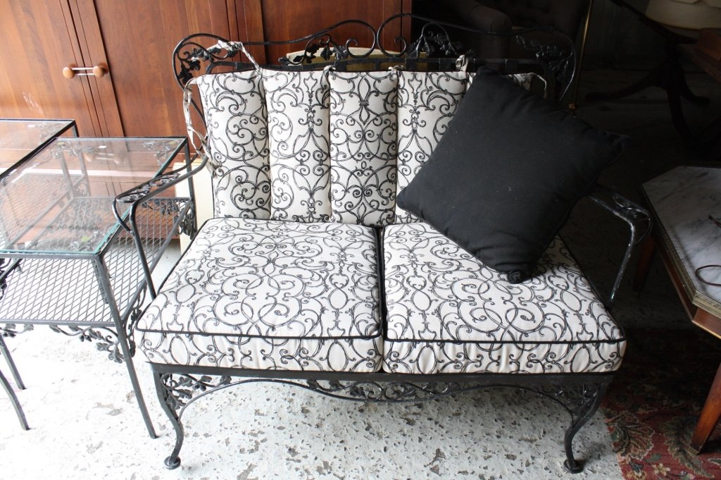 Vintage rod iron patio set with cushions: Vintage black vine pattern rod iron patio set includes, love seat, coffee table. Two end tables. Sofa. Excellent condition, black and white scrolled design upholstery with black cord trim. Sofa measur